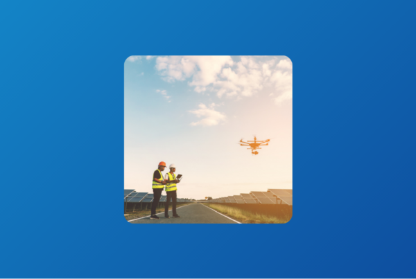 Two engineers flying a drone on a solar field